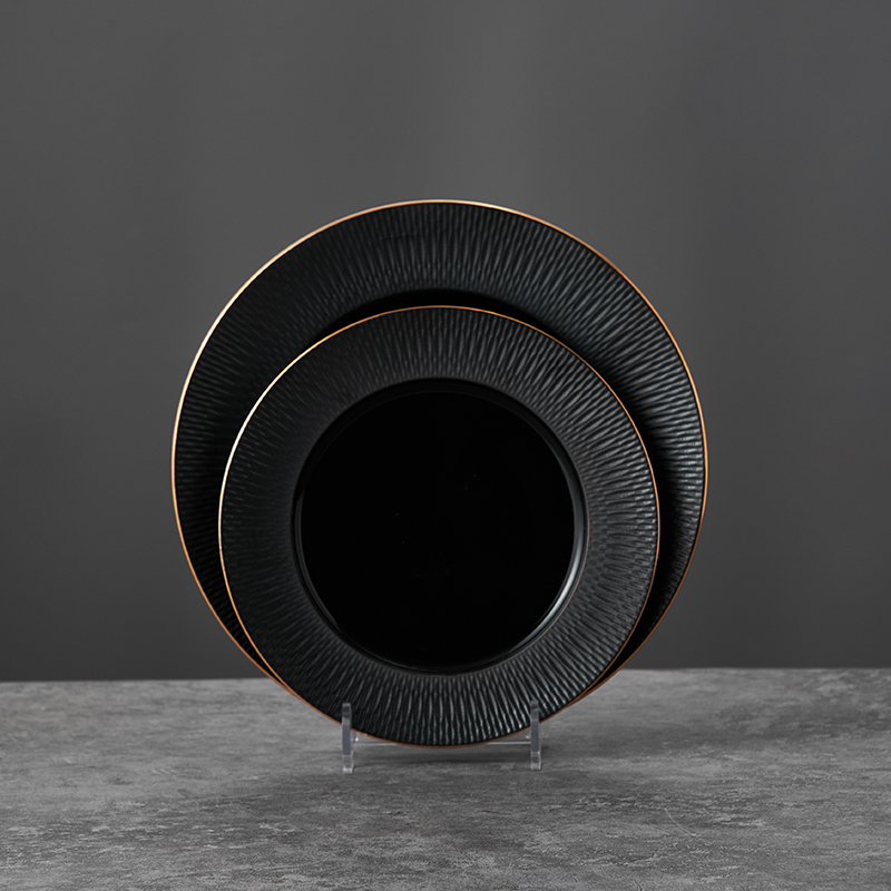 Black ceramic plates with gold rim