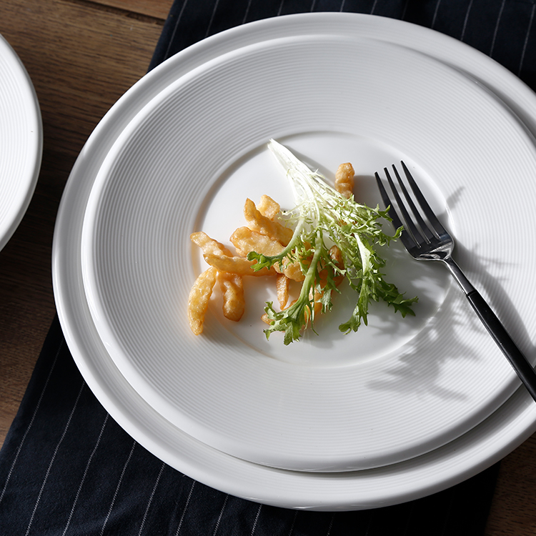 salad in a plate with a fork on the side