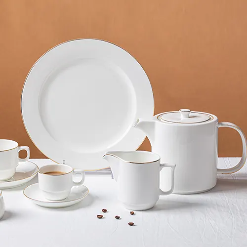 white ceramic dinnerware set with gold rim